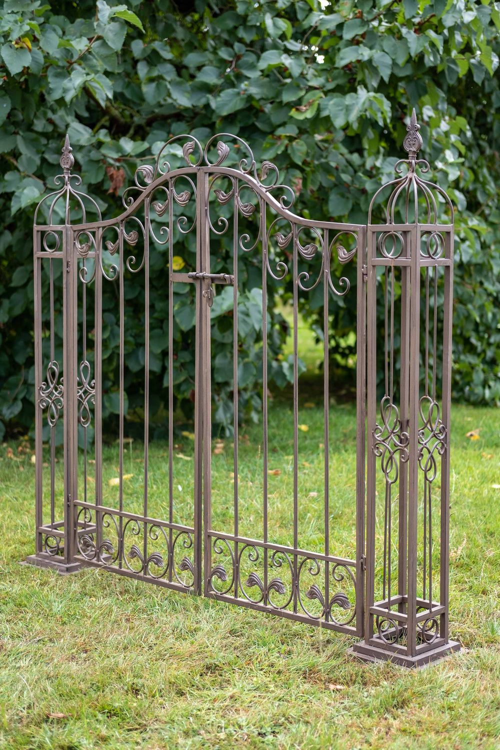 Ascalon Ornamental Gates - 'Rust Brown' placed in garden at an angle