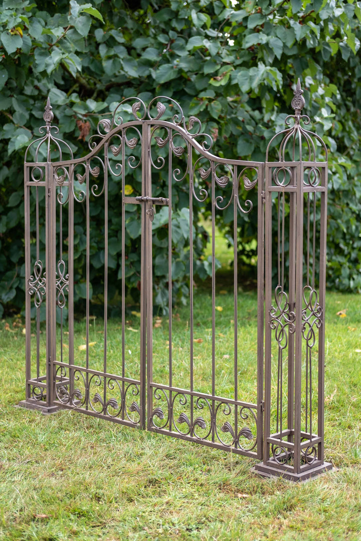 Ascalon Ornamental Gates - 'Rust Brown' placed in garden at an angle