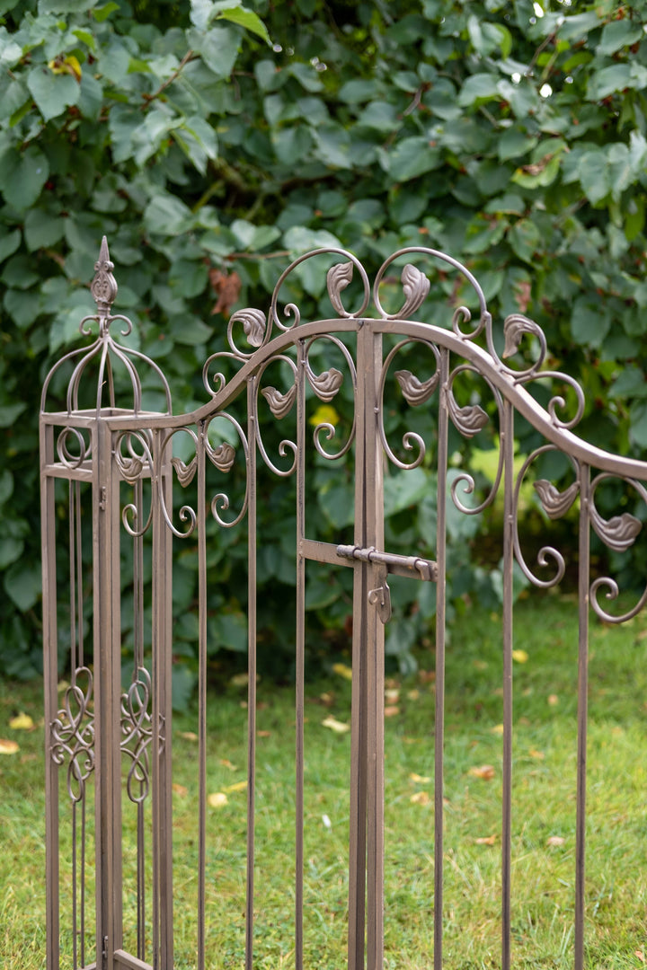 Ascalon Ornamental Gates - 'Rust Brown' placed in garden at an angle zoom in