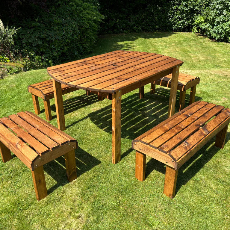 KNIGHTS SIX SEATER RECTANGULAR TABLE SET - Table on grass in sunshine, four benches, pond. 