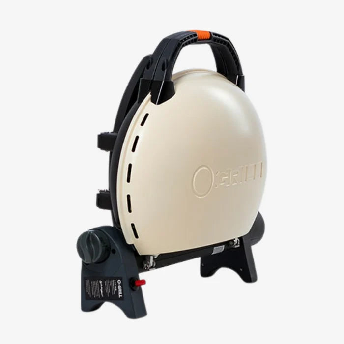 A cream coloured O-Grill 500 folded up and on it's side
