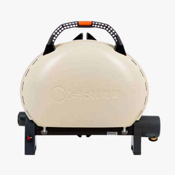 A cream coloured O-Grill 500 folded up with a carrying handle
