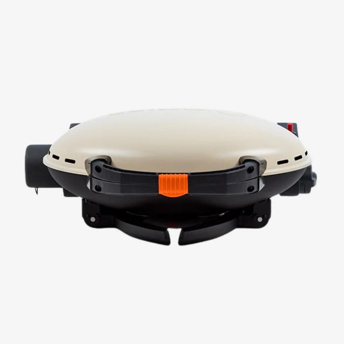 A cream coloured O-Grill 500 folded up and laying flat
