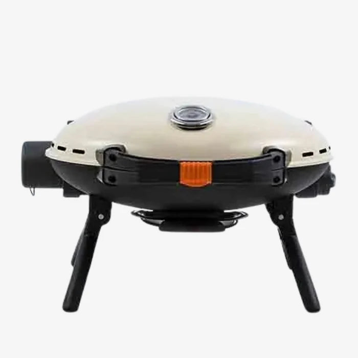 A cream coloured O-Grill 500 standing on unfolded legs