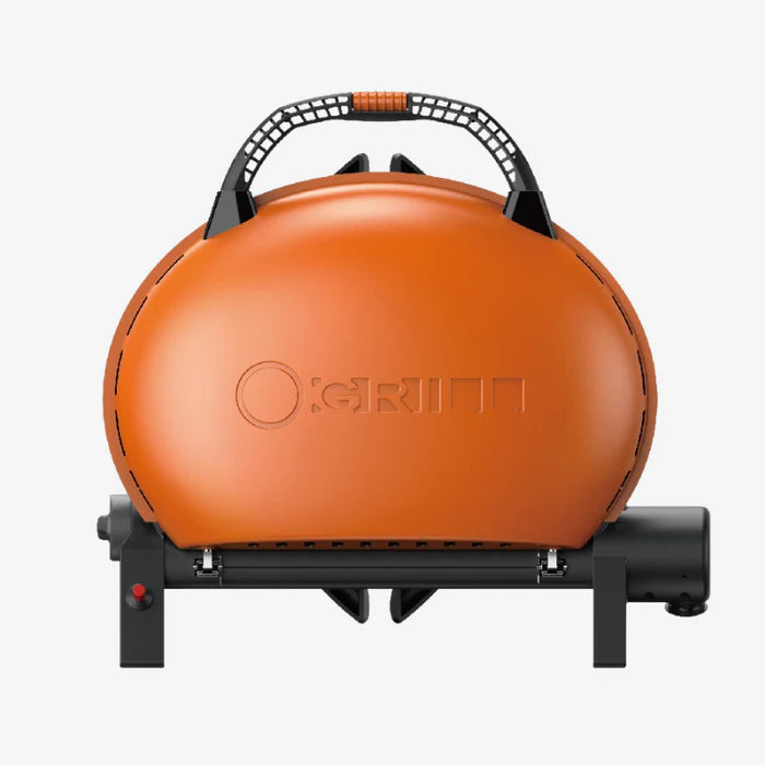 The O-Grill 500 in orange, folded up with a carrying handle
