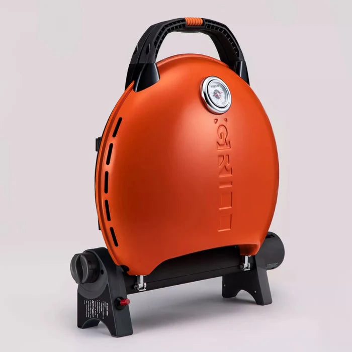A closeup of an orange -grill 600 folded up.