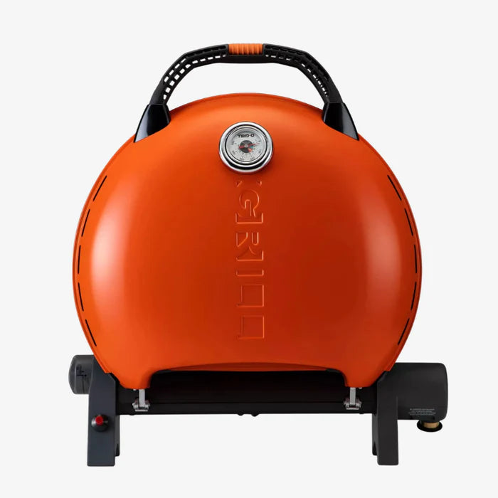 An orange o-grill 600 folded up against a white background