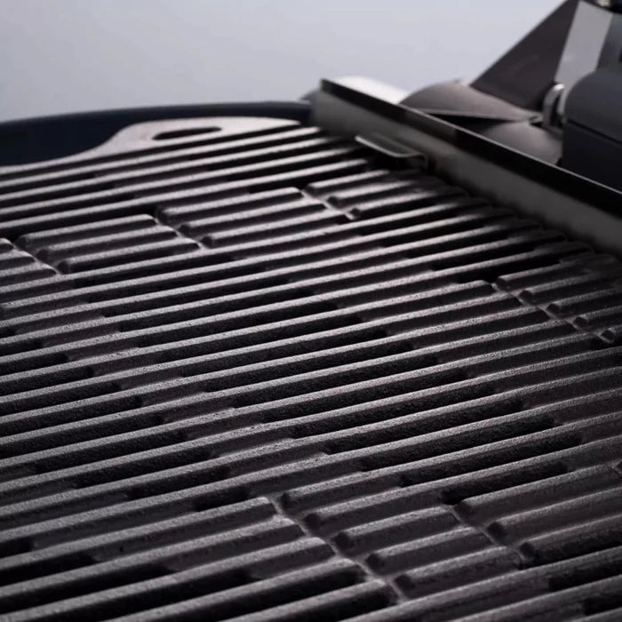 A closeup of the O-Grill 900 cast iron grill