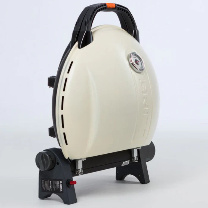 A side view of the cream O-Grill 900 folded up
