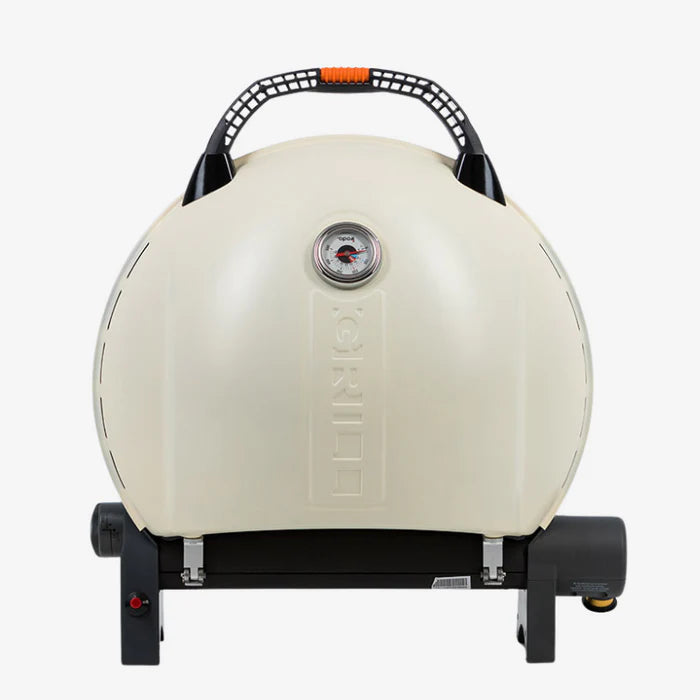 A cream O-grill 900 folded and standing on its back against a white background