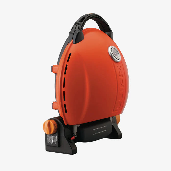 A closeup of the orange O-Grill 900 from the side