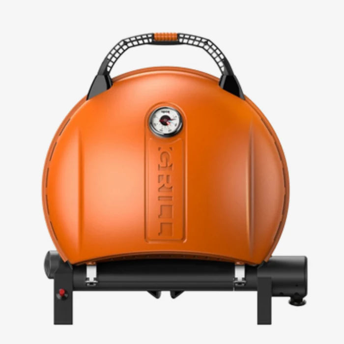 A orange O-grill 900 folded and standing on its back against a white background