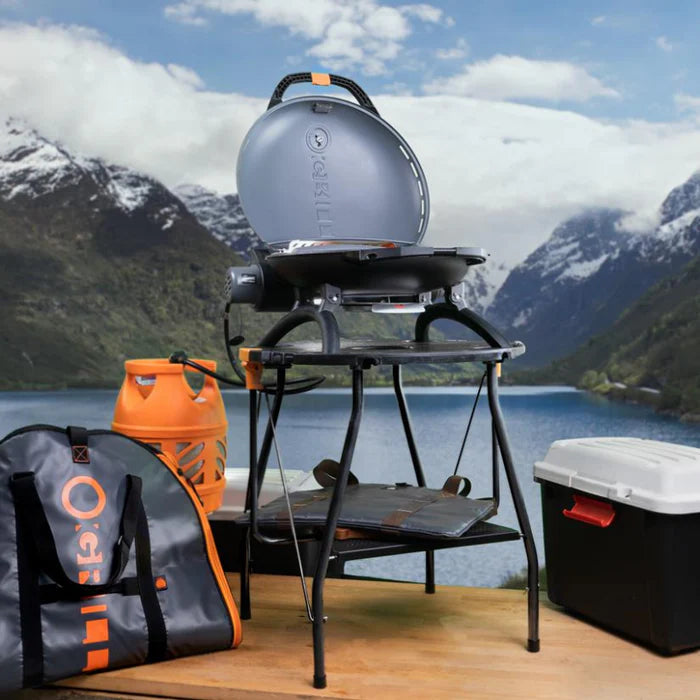 A black o-grill 500 beside all of its accessories